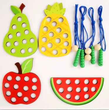 Wooden fruit threading board placed in Montessori early education threading game by eprolo