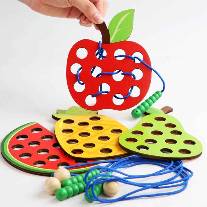 Wooden fruit threading board placed in Montessori early education threading game by eprolo